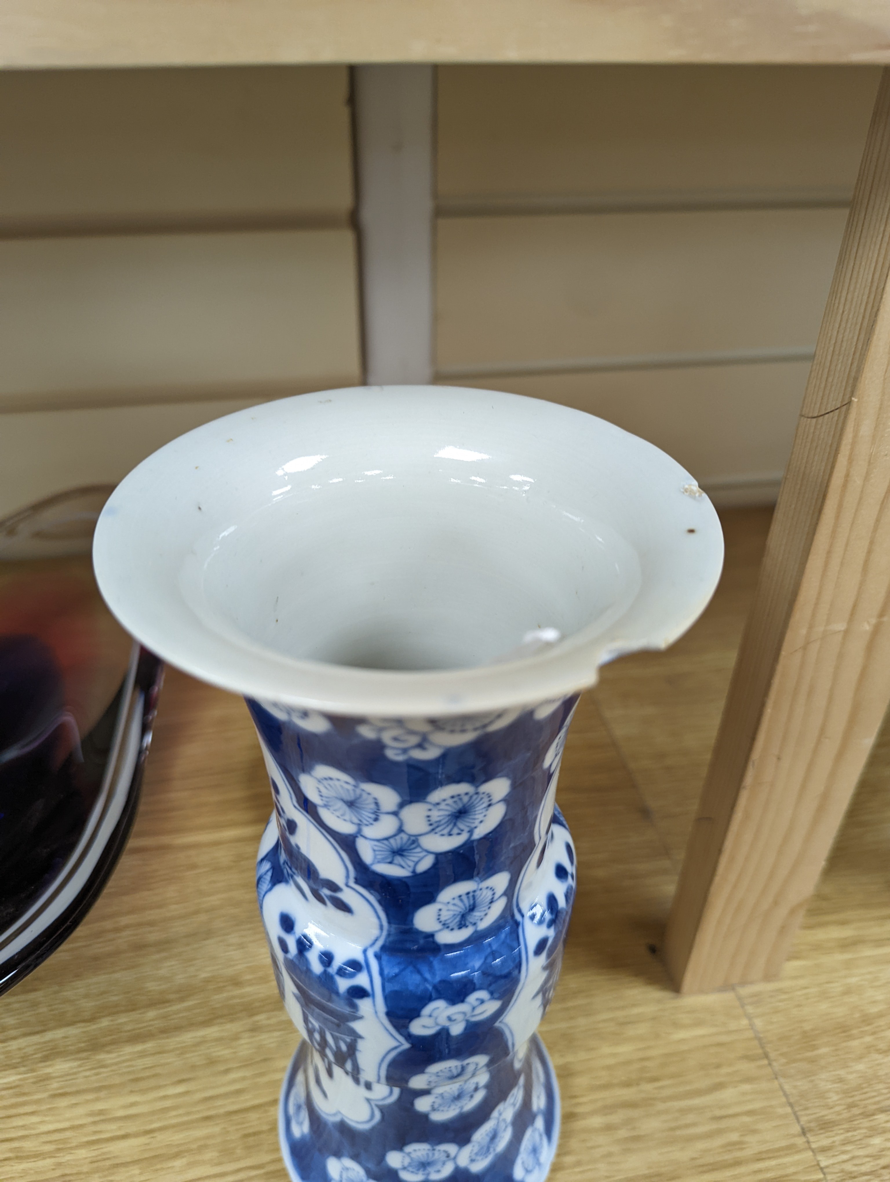 A 19th century Chinese blue and white prunus gu vase, 25 cms high.